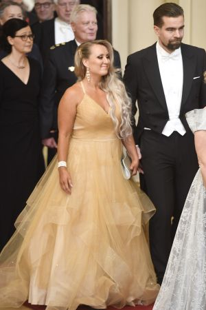 Jussi Ahokas (till höger) tillsammans med sin fru Elina. Jussi Ahokas med sin fru på slottsbalen.