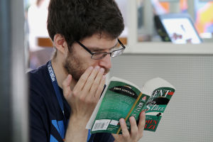 A man is reading a book.