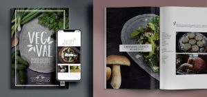 Två kokböcker på ett bord med texten "vegval". På ena boken ligger det en mobiltelefon med en digital version av boken öppen.