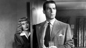 Fred MacMurray ja Barbara Stanwyck elokuvassa Nainen ilman omaatuntoa (1944).