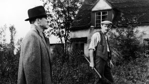 Dana Andrews (vasemmalla) elokuvassa Paholaisen palvelija