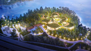 Pressbild över Lastenmaailma ry:s planer för "Barnens värld" på Björnholm i Esbo. Planeringsbild med Västerleden, tallar, byggnader och upplysta spår på en ö, havet i bakgrunden.