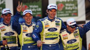 Marcus Grönholm och Timo Rautiainen firar efter sitt sista VM-rally tillsammans med vinnarna Mikko Hirvonen och Jarmo Lehtinen år 2007. Marcus Grönholm och Timo Rautiainen firar efter sitt sista VM-rally tillsammans med vinnarna Mikko Hirvonen och Jarmo Lehtinen.