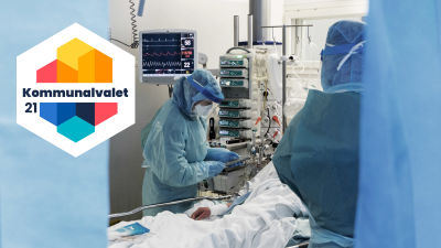 Bild där läkare och vårdpersonal i skyddsdräkt sköter om en patient.