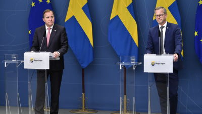 Bild på två män i kostym.