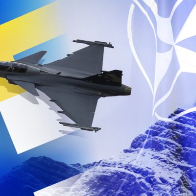 Suomen ja ruotsin ja naton lippuja.
