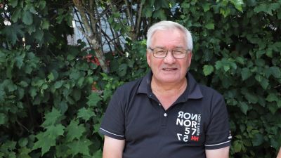 Raimo Tapio, en man med grått hår och glasögon.