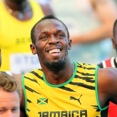Usain Bolt hymyilee juoksun jälkeen.