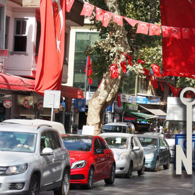 Photo of traffic on city street in Turkey, featuring the All Points North podcast logo.