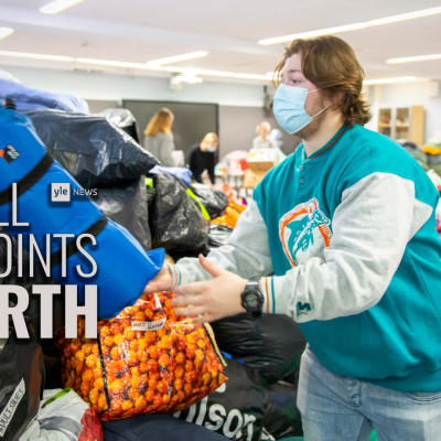 Students in Joensuu sorting donations headed to the Ukraine region, featuring the All Points North podcast logo.