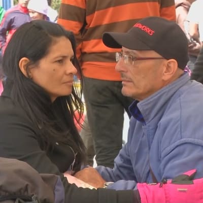 Venezolanerna Gabriel Malavolta och hans fru Yenni vid gränsen mellan Colombia och Ecuador i augusti 2018.