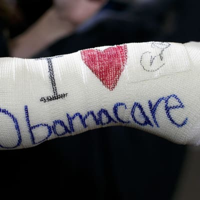 Obamacaren kannattaja kuvattuna Yhdysvaltain Massachusettsissa.