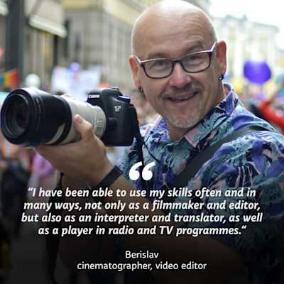 A man with glasses holding a camera. On top of the image the text "I have been able to use my skills often and in many ways, not only as a filmmaker and editor, but also as an interpreter and translator, as well as a player in radio and TV programmes." Berislav, cinematographer, video editor.