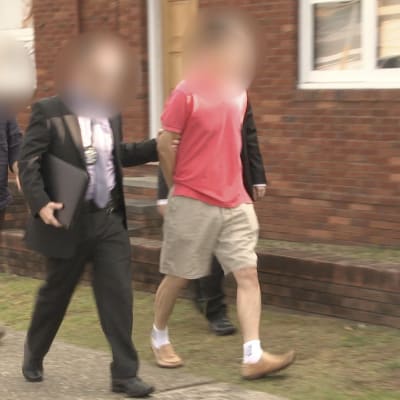 Polisen i Australien gav ut denna bild av den misstänkte agenten då han greps