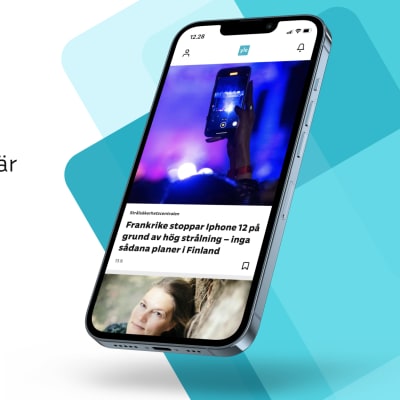 På bilden en telefon. På skärmen visas en nyhet i Yle-appen.