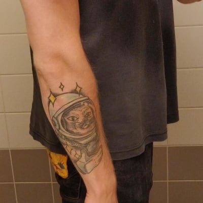 Tatuering av en kattastronaut