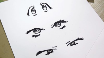 Ett tecknepapper med olika tecknade ögon.