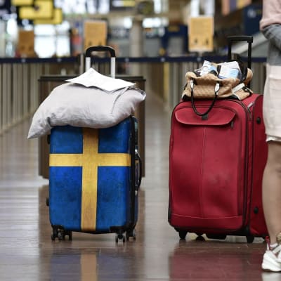 Resenärer på Arlanda flygplats i Stockholm.