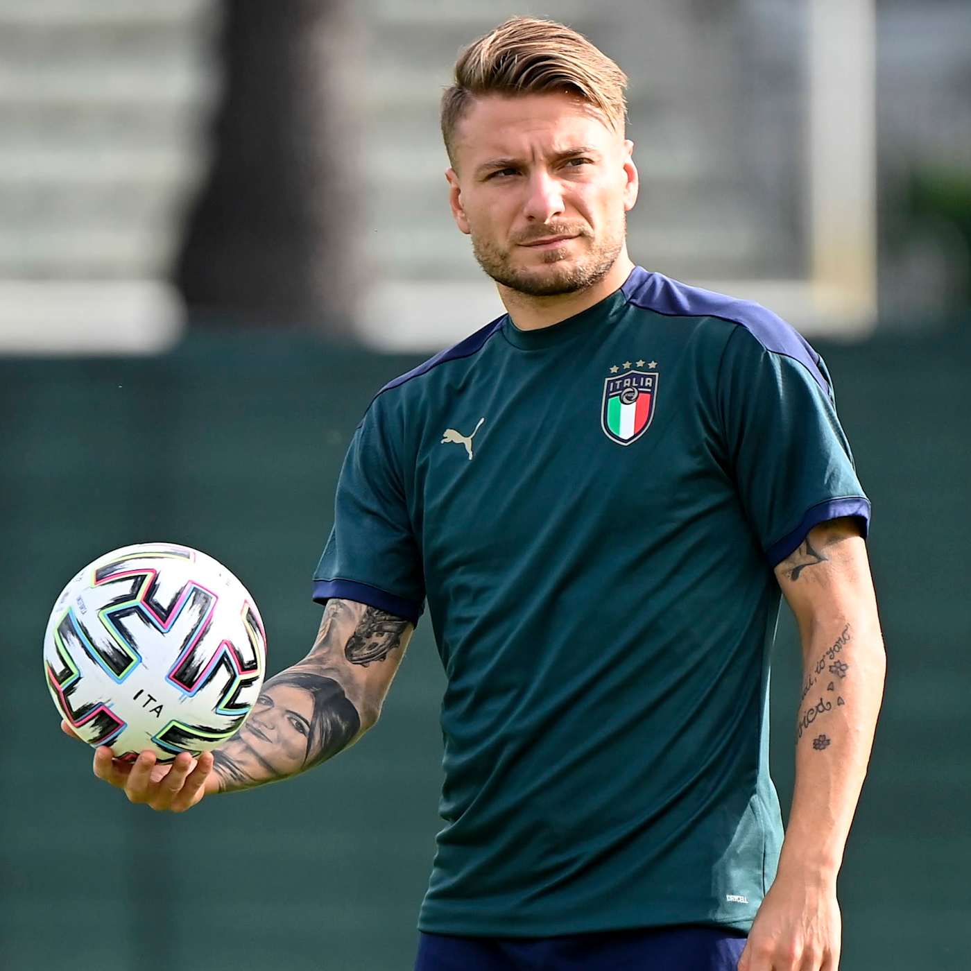 Ciro Immobile holds the ball during a training session.