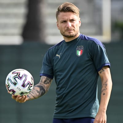 Ciro Immobile holds the ball during a training session.