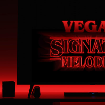 En TV i rött sken med texten Vega hjärta signaturmelodier