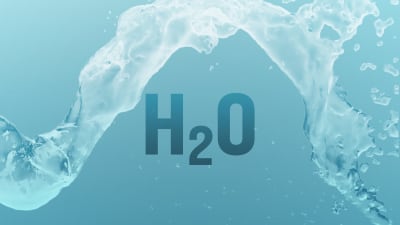 Veden kemiallinen merkki H2O ja vesiroiske.