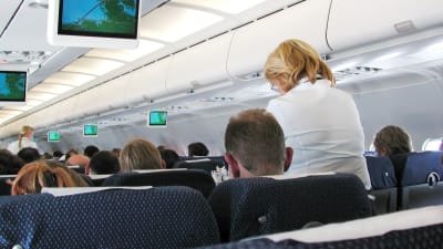 Passagerare i ett Finnairflygplan