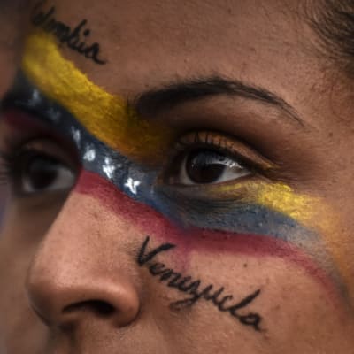 Venezuela i kris. Ett ansikte med texten Venezuela.