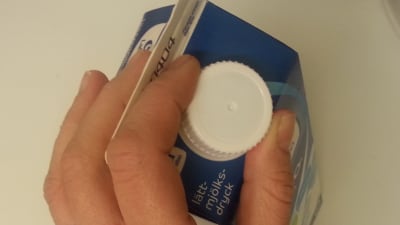 Mjölkförpackning med skruvkork