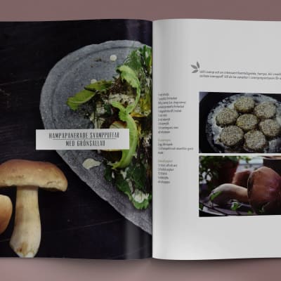 Två kokböcker på ett bord med texten "vegval". På ena boken ligger det en mobiltelefon med en digital version av boken öppen.