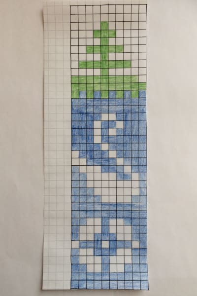 Stickmönster med färgade rutor