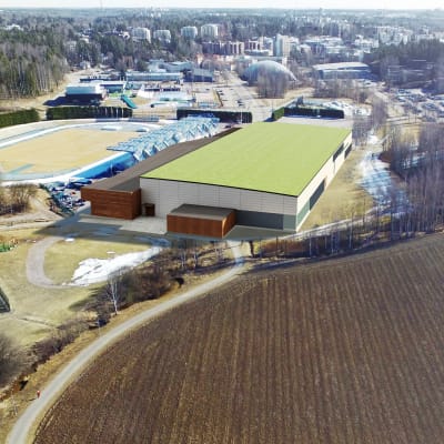Arkitektbild över ny idrottshall i Alberga, bakom hallen syns nuvarande stadion och simhall. 