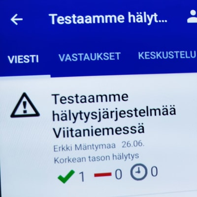 Älypuhelimen näytöllä tieto Secapp-hälytysjärjestelmän testaamisesta Gradian tiloissa Jyväskylän Viitaniemessä. 