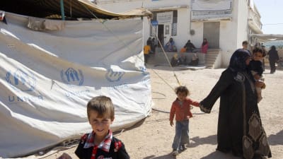 Syriska flyktingar i ett Jordanskt flyktingläger.
