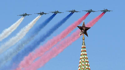 Russian Su-25 assault aircrafts release smoke in the colours of the Russian flag while flying above the Kremlin, during the rehearsal for the Victory Day military parade at the Red Square in Moscow, Russia, 07 May 2015.