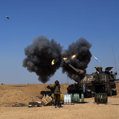 Israeli artillery shelling toward targets in the Gaza Strip form at an unspecified location next to the Israeli Gaza Strip border.