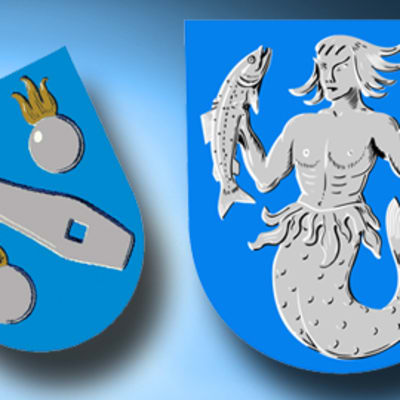 Oravaisten vaakuna vasemmalla, oikealla Vöyri-Maksamaan vaakuna.