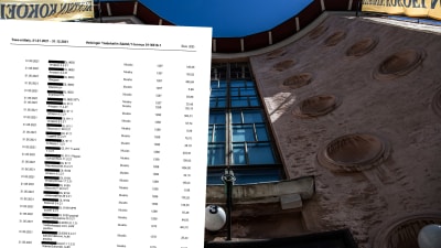 Framsidan av en byggnad, fotograferad framför byggnaden rakt upp med ett snett perspektiv. I framgrunden bilden på ett dokument.