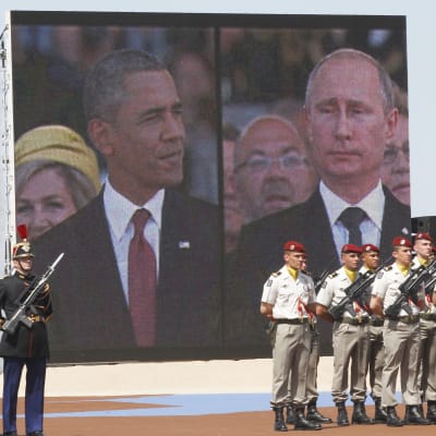 Barack Obama och Vladimir Putin under 70-årsdagen av landstigningen i Normandie