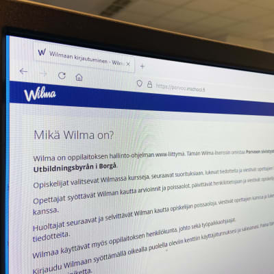 En skärm där webbplatsen för portalen Wilma för skolorna i Borgå syns.