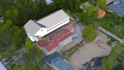 Bild där en ny tilläggsbyggnad ritats in bredvid skolhus