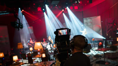 An image from the studio. In the foreground a camera man. 