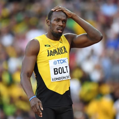 Usain Bolt håller sig för huvudet