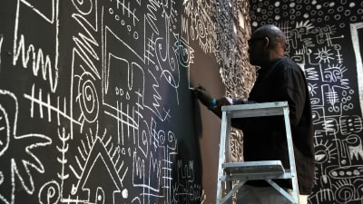 Victor EkPuk works on his piece 'Meditation on Memory' as part of the 12th edition of the Havana Art Biennial, in Havana, Cuba, 22 May 2015.