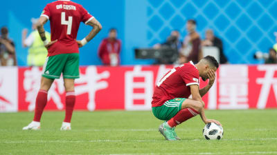 Marockos spelare sörjer över förlust.