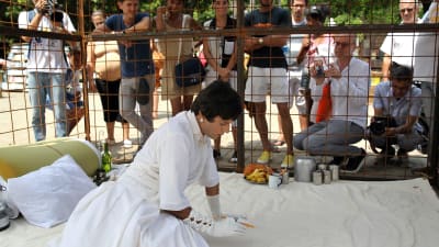 Indian artist Nikhil Chopra performs inside a cage during the 12th edition of the Havana Art Biennial, in Havana, Cuba, 22 May 2015.