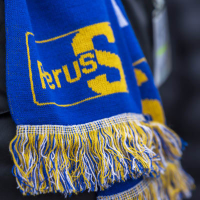 Kaulaliina, jossa Perussuomalaisten tunnus.