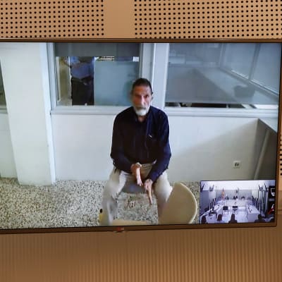 John McAfee hörs per videolänk under en utlämningsförhandling den 15 juni 2021 i Spanien. 