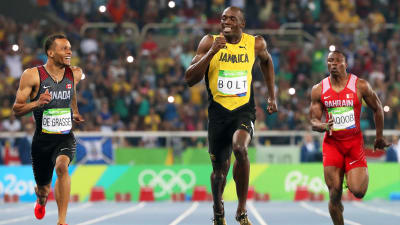 Usain Bolt och Andre De Grasse ler under semifinalen i 200 meter, OS i Rio.
