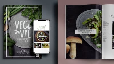 Två kokböcker på ett bord med texten "vegval". På ena boken ligger det en mobiltelefon med en digital version av boken öppen.